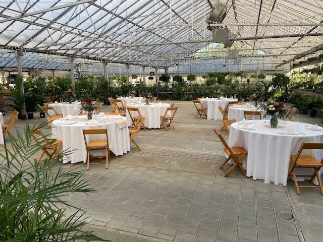 A large room with tables and chairs in it
