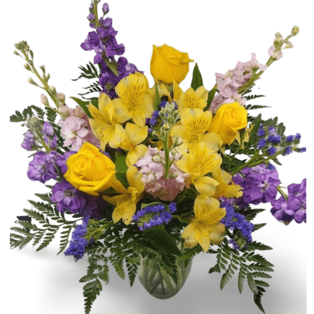 Yellow and purple flower arrangement in vase.