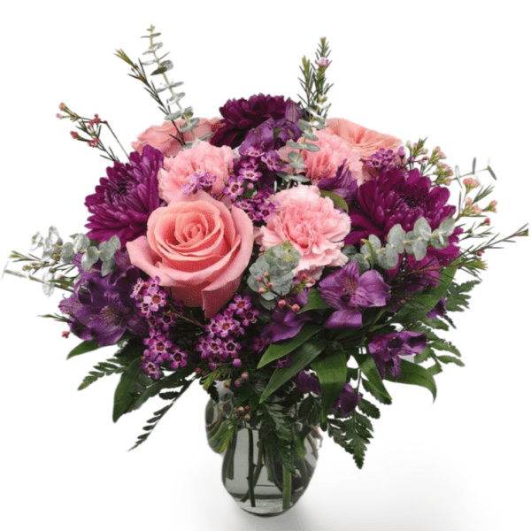 Pink and purple flower bouquet in vase.