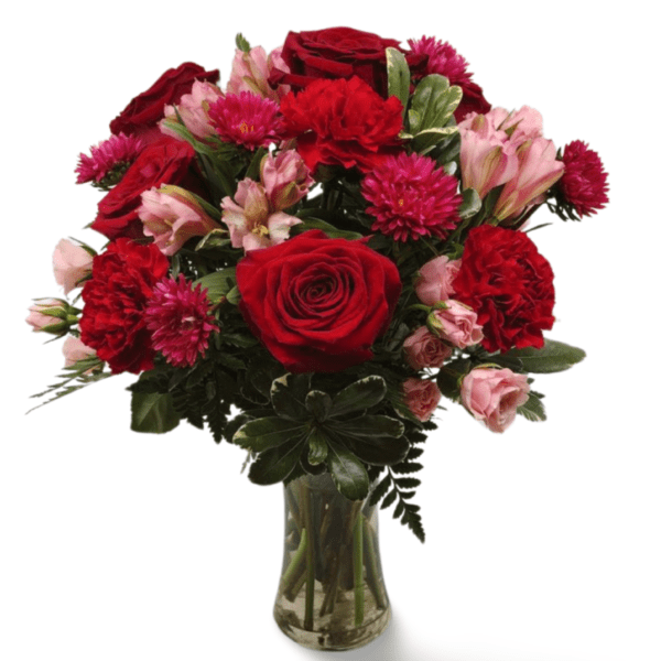 Red and pink roses bouquet in vase.