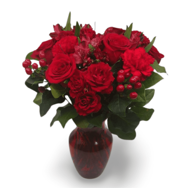 Red roses and carnations in vase.